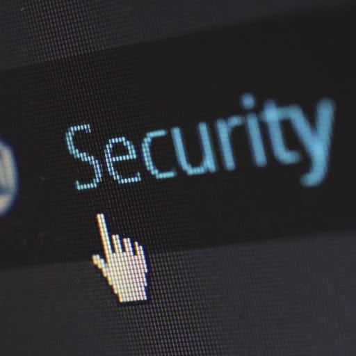 Computer screen with a mouse pointer hovering over the word "security."