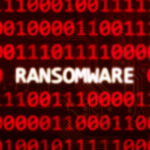 Ransomware text on random binary code red screen.