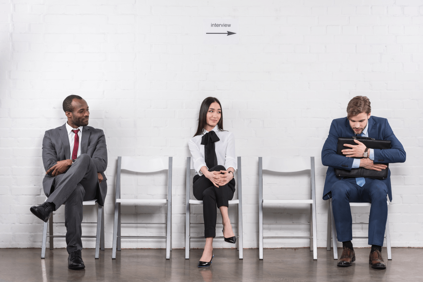 Three People waiting for an interview