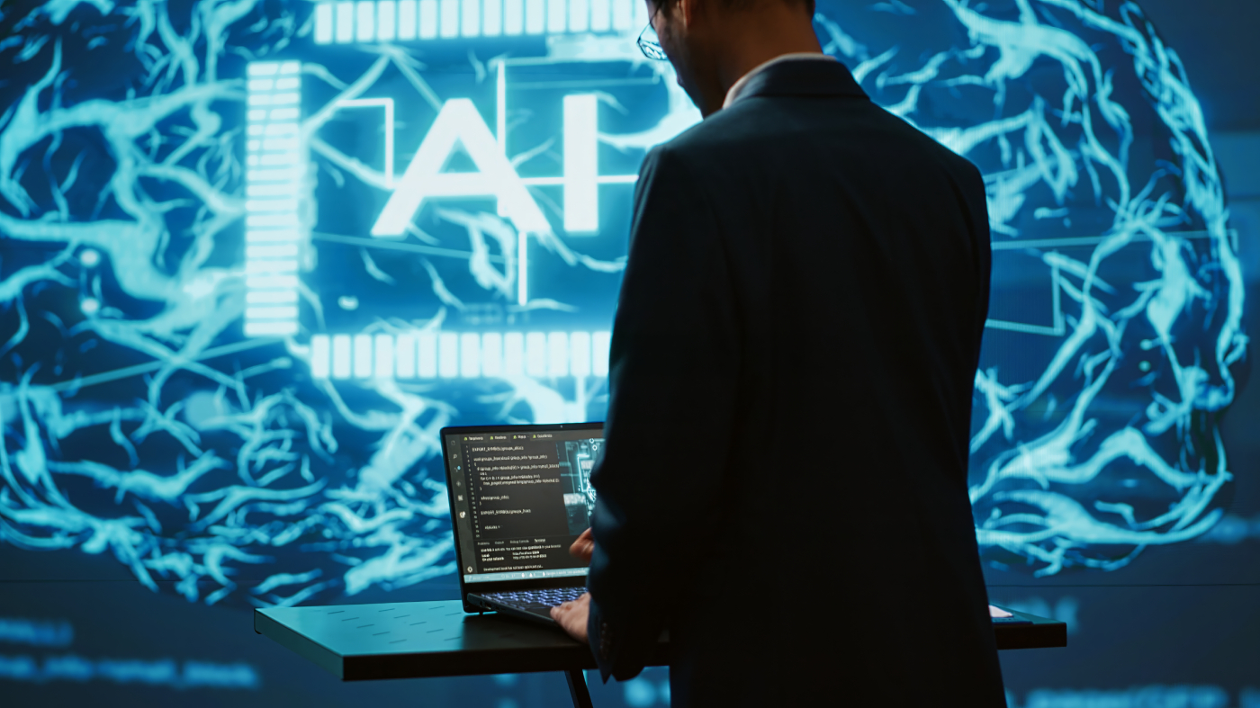 AI system administrator using laptop device in high tech futuristic workspace.