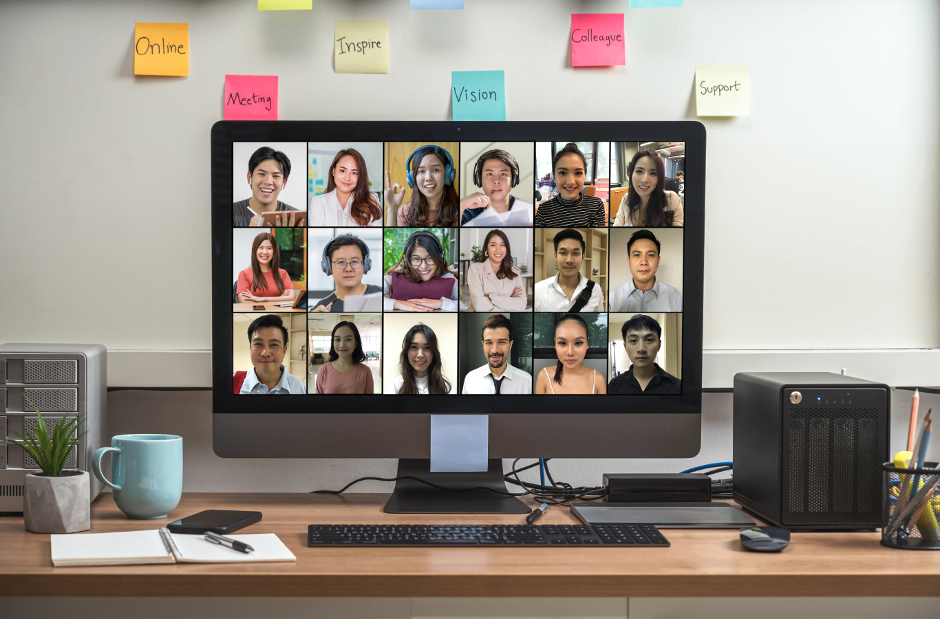 A computer monitor featuring a conference call with a remote team for work.