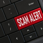 Scam Alert written on keycaps of keyboard.