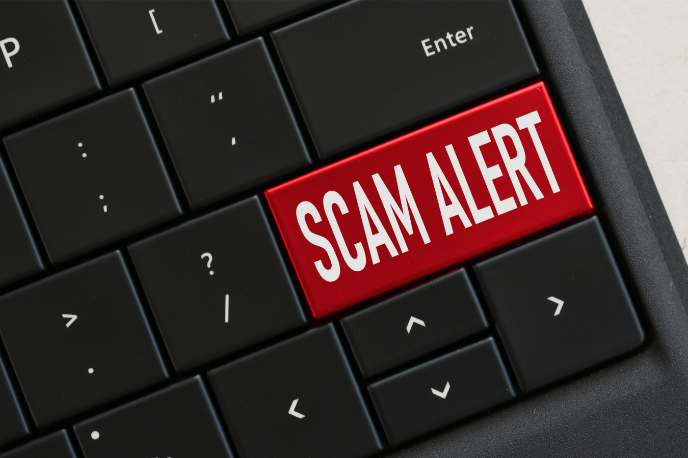Scam Alert written on keycaps of keyboard.